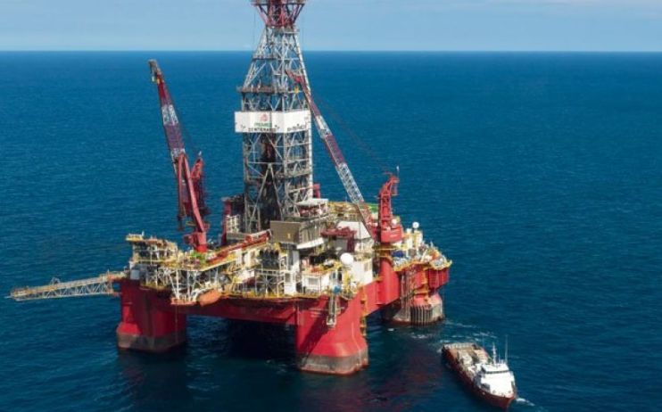 An oil rig stands in the ocean as Premier Oil boosts production thanks to its Catcher field