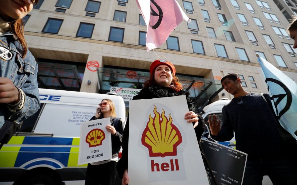 Ground to a halt: Climate change protesters smash windows at Shell's ...