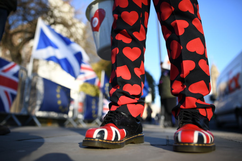 LONDON, ENGLAND - FEBRUARY 14: A man wears heart patterned trousers and Union Jack patterned shoes on February 14, 2019 in London, England.  MPs are set to debate and vote on the next steps in the Brexit process later today as Prime Mimister Theresa May continues to try to get her deal through Parliament. (Photo by Leon Neal/Getty Images)