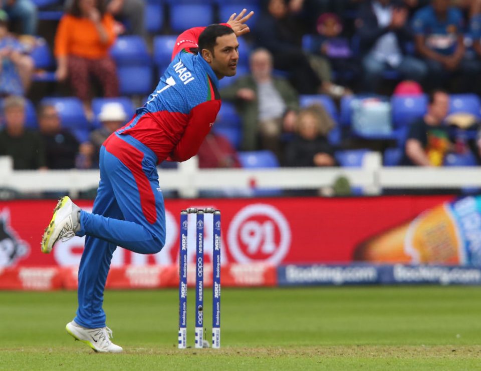 Afghanistan's Mohammad Nabi bowls during the 2019 Cricket World Cup group stage match between Afghanistan and Sri Lanka at Sophia Gardens stadium in Cardiff, south Wales, on June 4, 2019. (Photo by GEOFF CADDICK / AFP) / RESTRICTED TO EDITORIAL USE        (Photo credit should read GEOFF CADDICK/AFP/Getty Images)