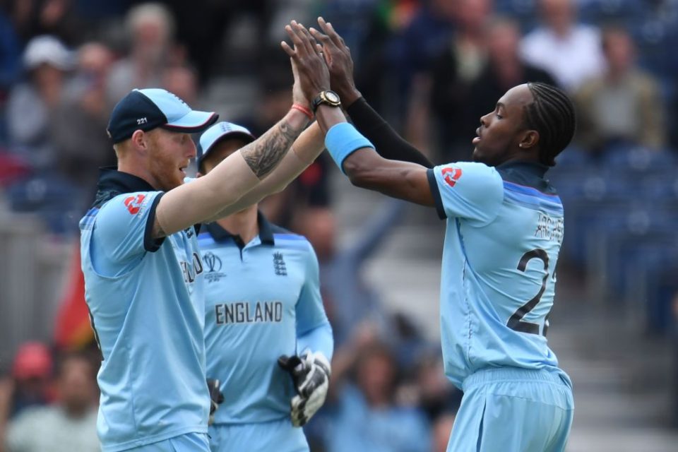 England's Jofra Archer (R) celebrates taking the wicket of Afghanistan's Rashid Khan during the 2019 Cricket World Cup group stage match between England and Afghanistan at Old Trafford in Manchester, northwest England, on June 18, 2019. (Photo by Dibyangshu SARKAR / AFP) / RESTRICTED TO EDITORIAL USE        (Photo credit should read DIBYANGSHU SARKAR/AFP/Getty Images)