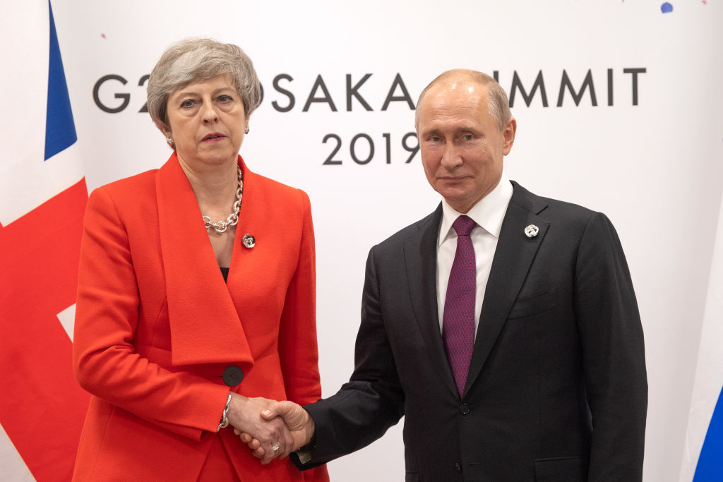 OSAKA, JAPAN - JUNE 28: Britain's Prime Minister, Theresa May, meets Russia's President, Vladimir Putin, during a bilateral meeting on the first day of the G20 summit on June 28, 2019 in Osaka, Japan. U.S. President Donald Trump arrived in Osaka on Thursday for the annual Group of 20 gathering together with other world leaders who will use the two-day summit to discuss pressing economic, climate change, as well as geopolitical issues. The US-China trade war is expected to dominate the meetings in Osaka as President Trump and China's President Xi Jinping are scheduled to meet on Saturday in an attempt to resolve the ongoing the trade clashes between the world's two largest economies. (Photo by Carl Court/Getty Images)