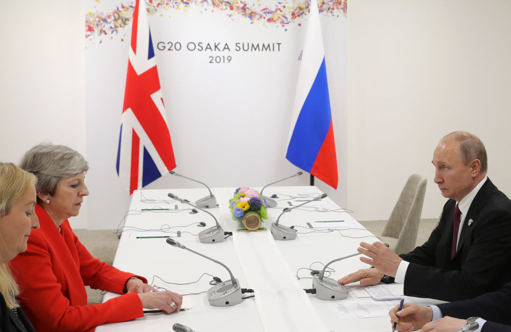Russian President Vladimir Putin and British Prime Minister Theresa May hold a meeting on the sidelines of the G20 summit in Osaka on June 28, 2019. (Photo by Mikhail Klimentyev / SPUTNIK / AFP)        (Photo credit should read MIKHAIL KLIMENTYEV/AFP/Getty Images)