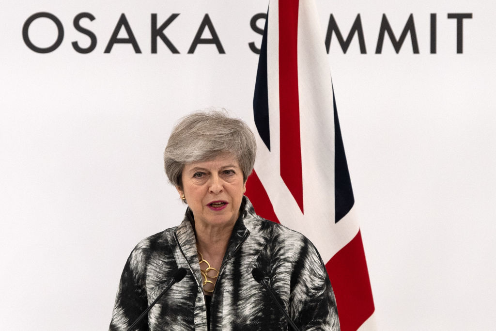 OSAKA, JAPAN - JUNE 29: Britain's Prime Minister, Theresa May, speaks during a press conference at the end of the G20 summit on June 29, 2019 in Osaka, Japan. U.S. President Donald Trump and Chinese President Xi Jinping agreed to resume trade negotiations on Saturday during their meeting in Osaka at the annual Group of 20 summit, in an attempt to resolve a trade deal between the world's two largest economies. According to reports, both leaders agreed that the U.S. would not impose new tariffs during their discussion as world leaders met in Osaka during the two-day G20 summit to discuss economic, environmental and geopolitical issues. (Photo by Carl Court/Getty Images)