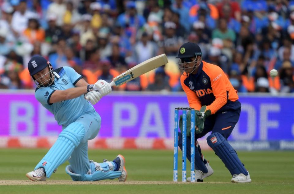 England's Jonny Bairstow (L) is watched by India's Mahendra Singh Dhoni as he plays a shot during the 2019 Cricket World Cup group stage match between England and India at Edgbaston in Birmingham, central England, on June 30, 2019. (Photo by Dibyangshu Sarkar / AFP) / RESTRICTED TO EDITORIAL USE        (Photo credit should read DIBYANGSHU SARKAR/AFP/Getty Images)