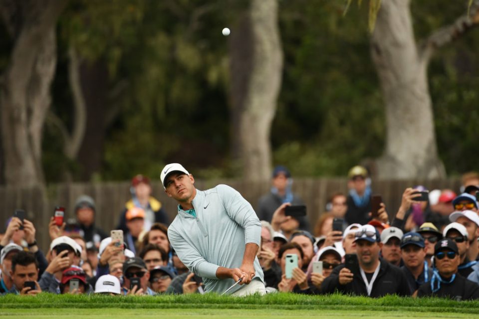 PEBBLE BEACH, CALIFORNIA - JUNE 16: Brooks Koepka of the United States plays a third shot on the 14th hole during the final round of the 2019 U.S. Open at Pebble Beach Golf Links on June 16, 2019 in Pebble Beach, California. (Photo by Ross Kinnaird/Getty Images)