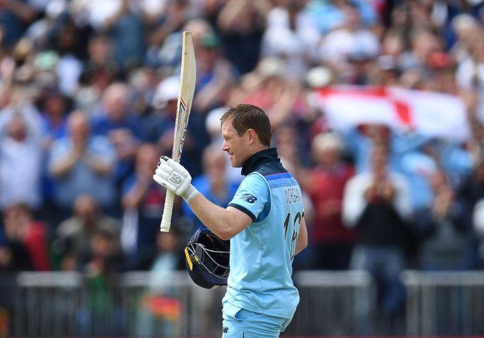 MANCHESTER, ENGLAND - JUNE 18: Eoin Morgan of England celebrates his century with Joe Root of England during the Group Stage match of the ICC Cricket World Cup 2019 between England and Afghanistan at Old Trafford on June 18, 2019 in Manchester, England. (Photo by Clive Mason/Getty Images)