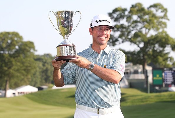 CROMWELL, CONNECTICUT - JUNE 23: Chez Reavie of the United States poses with the trophy after winning the Travelers Championship at TPC River Highlands on June 23, 2019 in Cromwell, Connecticut. (Photo by Rob Carr/Getty Images)