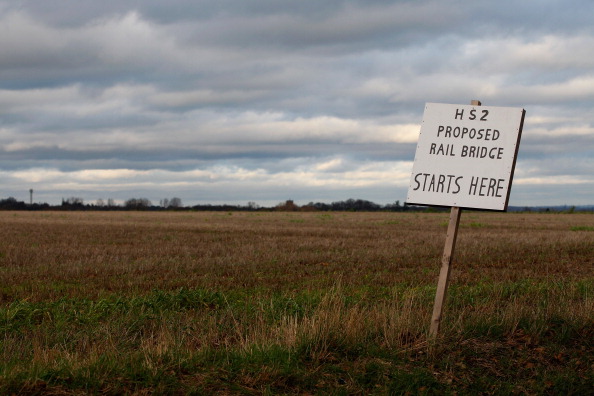MIDDLETON, UNITED KINGDOM - JANUARY 10: A placard erected by protesters marks the spot where a new rail bridge is proposed to be built across the countryside for the new HS2 high speed train link at the village of Middleton in Staffordshire on January 10, 2012 in Middleton, United Kingdom. The government today gave the go ahead for the proposed high-speed rail line between London and Birmingham which will be routed through countryside with trains travelling as fast as 225 mph. (Photo by Christopher Furlong/Getty Images)