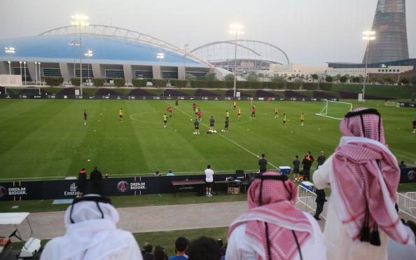 A general view shows Qataris watching Paris Saint-Germain football team training at the Aspire Academy of Sports Excellence in the Qatari capital Doha on December 31, 2012. PSG is in Qatar for a week-long training camp before the resumption of the French Ligue 1 after the winter break. AFP PHOTO / AL-WATAN DOHA / KARIM JAAFAR == QATAR OUT ==        (Photo credit should read KARIM JAAFAR/AFP/Getty Images)
