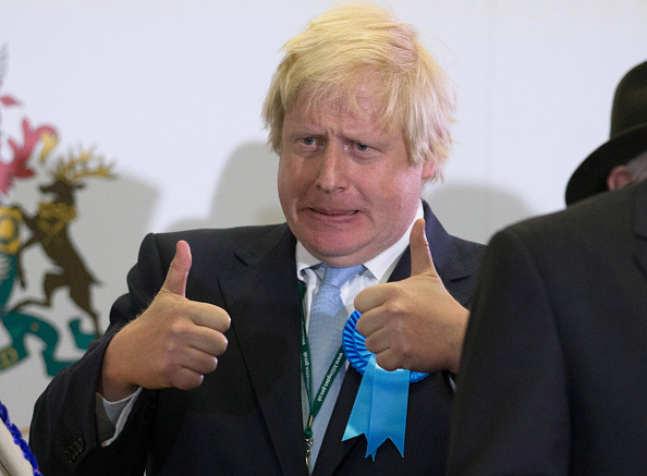 UXBRIDGE, ENGLAND - MAY 08:  (Alternate crop of #472458768) Boris Johnson, Conservative candidate for Uxbridge celebrates on stage following his win as he attends the count at Brunel University London on May 8, 2015 in Uxbridge, England. The United Kingdom has gone to the polls to vote for a new government in one of the most closely fought General Elections in recent history. With the result too close to call it is anticipated that there will be no overall clear majority winner and a coalition government will have to be formed once again.  (Photo by Matt Cardy/Getty Images)