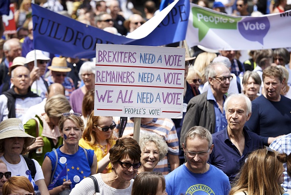 Demonstrators carry banners and flags as they participate in the People's March demanding a People's Vote on the final Brexit deal, in central London on June 23, 2018, the second anniversary of the 2016 referendum. - Tens of thousands of people demonstrated in London on Saturday calling for a second vote on Britain's departure from the European Union. (Photo by Niklas HALLE'N / AFP)        (Photo credit should read NIKLAS HALLE'N/AFP/Getty Images)