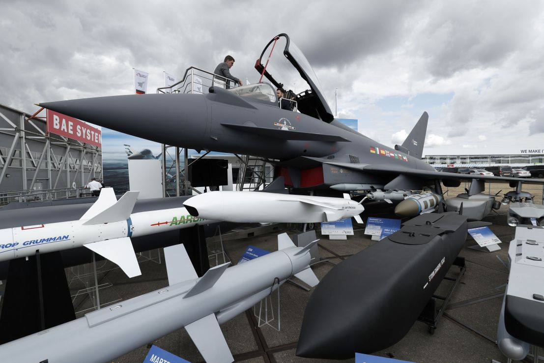 A man sits in the cockpit of a Eurofighter Typhoon aircraft at the BAE Systems exhibition space during the Farnborough Airshow, south west of London, on July 18, 2018. (Photo by Adrian DENNIS / AFP)        (Photo credit should read ADRIAN DENNIS/AFP/Getty Images)
