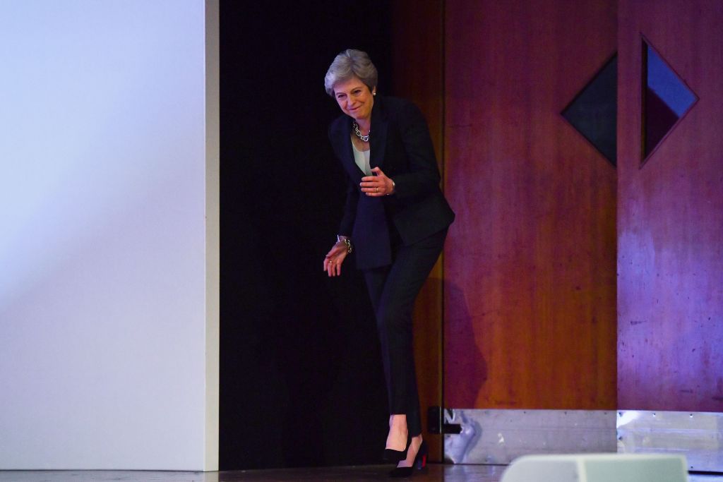 Britain's Prime Minister Theresa May dances a few steps as she takes the stage to give her keynote address on the fourth and final day of the Conservative Party Conference 2018 at the International Convention Centre in Birmingham, central England, on October 3, 2018. (Photo by Ben STANSALL / AFP)        (Photo credit should read BEN STANSALL/AFP/Getty Images)