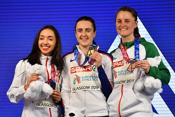 (L-R) Silver medallist Poland's Sofia Ennaoui, gold medallist Britain's Laura Muir and bronze medallist Ireland's Ciara Mageean pose on the podium after the womens 1500m final at the 2019 European Athletics Indoor Championships in Glasgow on March 3, 2019. (Photo by Ben STANSALL / AFP)        (Photo credit should read BEN STANSALL/AFP/Getty Images)