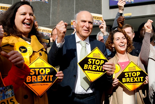 Liberal Democrats Party leader Vince Cable (C) reacts as he stands with party activists and canvasses for support for their candidates in the forthcoming European elections, in London on May 22, 2019. (Photo by Tolga AKMEN / AFP)        (Photo credit should read TOLGA AKMEN/AFP/Getty Images)