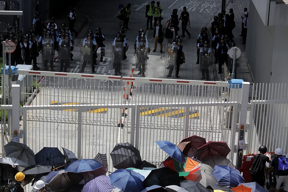 Hong Kong protesters and police stand off outside government headquarters