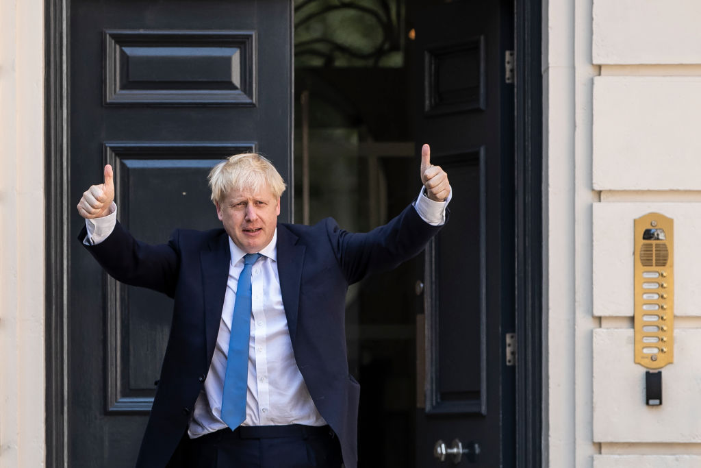 LONDON, ENGLAND - JULY 23: Newly elected Conservative party leader Boris Johnson poses outside the Conservative Leadership Headquarters on July 23, 2019 in London, England. After a month of hustings, campaigning and televised debates the members of the UK's Conservative and Unionist Party have voted for Boris Johnson to be their new leader and the country's next Prime Minister, replacing Theresa May. (Photo by Dan Kitwood/Getty Images)