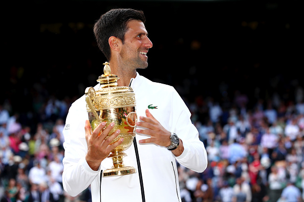 LONDON, ENGLAND - JULY 14: Novak Djokovic of Serbia poses for a photo with the trophy after winning his Men's Singles final against Roger Federer of Switzerland during Day thirteen of The Championships - Wimbledon 2019 at All England Lawn Tennis and Croquet Club on July 14, 2019 in London, England. (Photo by Clive Brunskill/Getty Images)