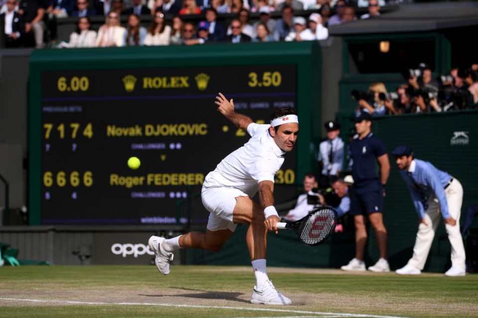 LONDON, ENGLAND - JULY 14: Roger Federer of Switzerland plays a backhand in his Men's Singles final against Novak Djokovic of Serbia during Day thirteen of The Championships - Wimbledon 2019 at All England Lawn Tennis and Croquet Club on July 14, 2019 in London, England. (Photo by Laurence Griffiths/Getty Images)