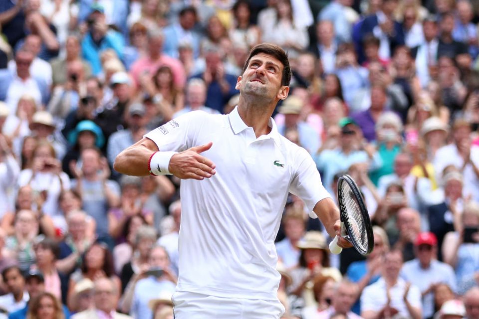 LONDON, ENGLAND - JULY 14:  Novak Djokovic of Serbia celebrates winning the Men's Singles final against Roger Federer of Switzerland during Day thirteen of The Championships - Wimbledon 2019 at All England Lawn Tennis and Croquet Club on July 14, 2019 in London, England. (Photo by Clive Brunskill/Getty Images)