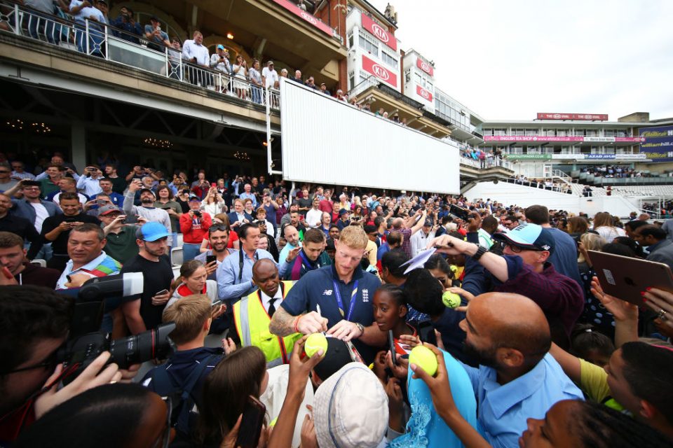 LONDON, ENGLAND - JULY 15: Ben Stokes of England signs autographs for fans during the England ICC World Cup Victory Celebration at The Kia Oval on July 15, 2019 in London, England. (Photo by Jordan Mansfield/Getty Images for Surrey CCC)