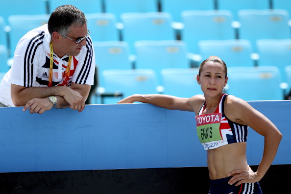 DAEGU, SOUTH KOREA - AUGUST 30:  Jessica Ennis of Great Britain talks to coach Toni Minichiello  during the javelin throw in the women's heptathlon during day four of the 13th IAAF World Athletics Championships at the Daegu Stadium on August 30, 2011 in Daegu, South Korea.  (Photo by Michael Steele/Getty Images)