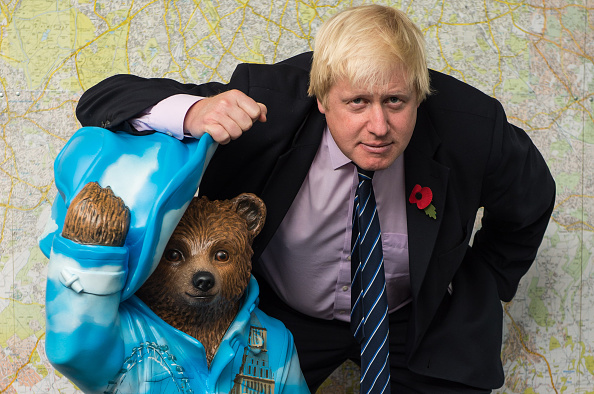 LONDON, ENGLAND - NOVEMBER 03: Boris Johnson stands with his 'Bear of London' Paddington Bear statue during the launch of The Paddington Trail at City Hall on November 3, 2014 in London, England. (Photo by Ian Gavan/Getty Images)