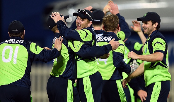 Ireland cricketers celebrate after winning at the Bellerive Oval ground during the 2015 Cricket World Cup Pool B match between Ireland and Zimbabwe in Hobart on March 7, 2015.  AFP PHOTO / INDRANIL MUKHERJEE  -- IMAGE RESTRICTED TO EDITORIAL USE - STRICTLY NO COMMERCIAL USE--        (Photo credit should read INDRANIL MUKHERJEE/AFP/Getty Images)