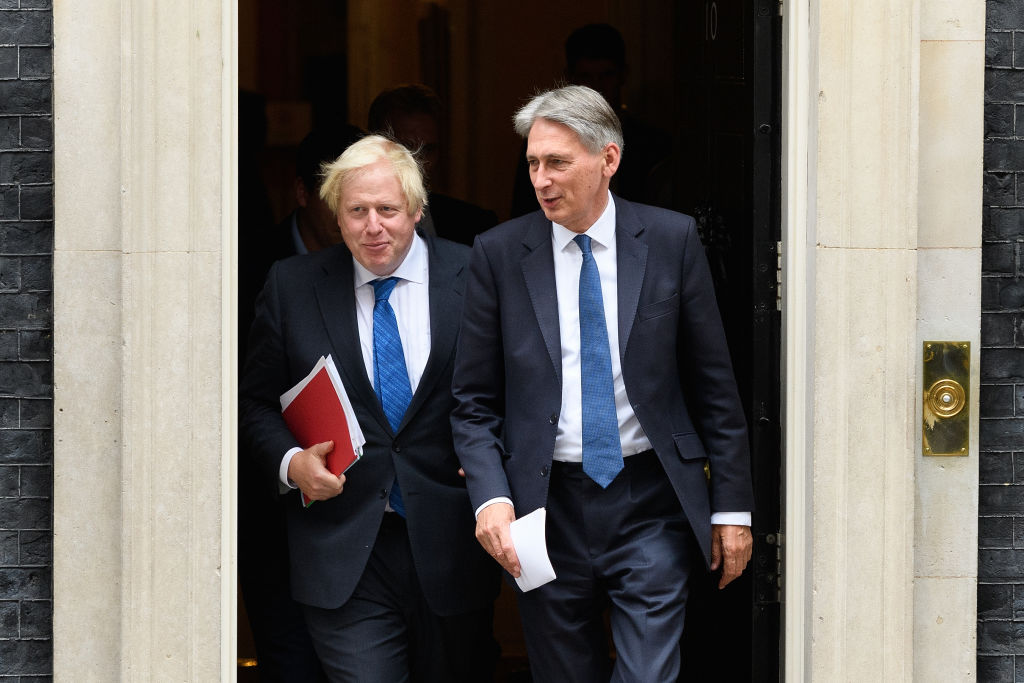 LONDON, ENGLAND - SEPTEMBER 21:  Britain's Foreign Secretary Boris Johnson (L) and Chancellor Philip Hammond leave number 10,  Downing Street following an extended Cabinet meeting on September 21, 2017 in London, England.  The Prime Minister Theresa May is expected to lay out her vision regarding Brexit during a speech in Florance tomorrow.  (Photo by Leon Neal/Getty Images)