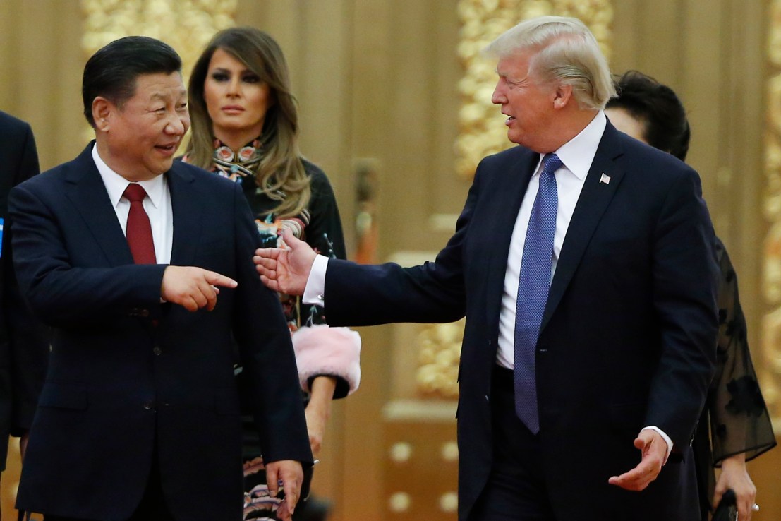 BEIJING, CHINA - NOVEMBER 9: U.S. President Donald Trump and China's President Xi Jinping arrive at a state dinner at the Great Hall of the People on November 9, 2017 in Beijing, China. Trump is on a 10-day trip to Asia.  (Photo by Thomas Peter - Pool/Getty Images)