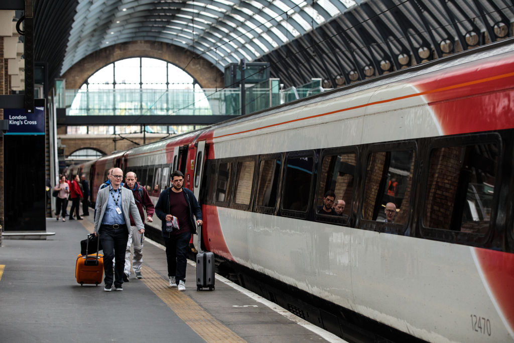 LONDON, ENGLAND - MAY 16: Passengers board a Virgin Trains East Coast train at Kings Cross Station on May 16, 2018 in London, England. East Coast trains are to be brought back under state control after Stagecoach and Virgin suffer a revenue shortfall on the £3.3bn contract to run the franchise. (Photo by Jack Taylor/Getty Images)