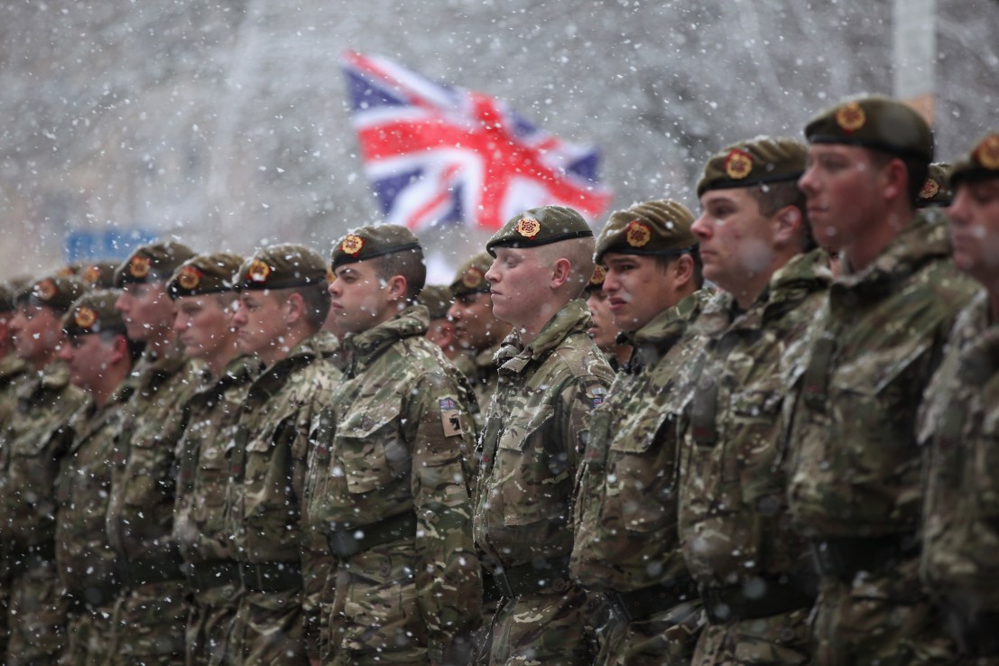 BLACKBURN, ENGLAND - DECEMBER 01:  Soldiers of The 1st Battalion Duke of Lancaster's Regiment brave the snow as they march through the streets of Blackburn following a six-month tour of duty in Afghanistan on December 1, 2010 in Blackburn, England. The 120 soldiers exercised their right to the freedom of the city by taking part in a thanksgiving service at Blackburn Cathedral and parading through the streets.  (Photo by Christopher Furlong/Getty Images)