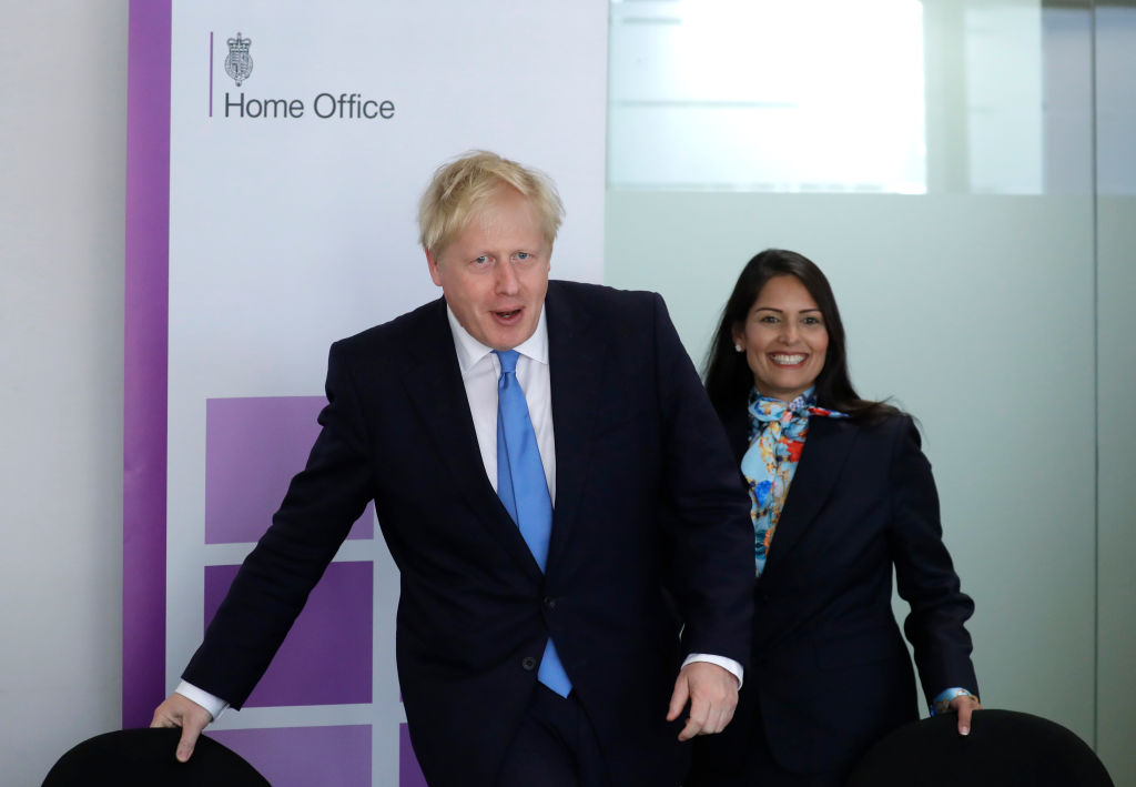 LONDON, ENGLAND - JULY 31: British Prime Minister Boris Johnson and Home Secretary Priti Patel attend the first meeting of the National Policing Board at the Home Office on July 31, 2019 in London, England. (Photo by Kirsty Wigglesworth - WPA Pool/Getty Images)