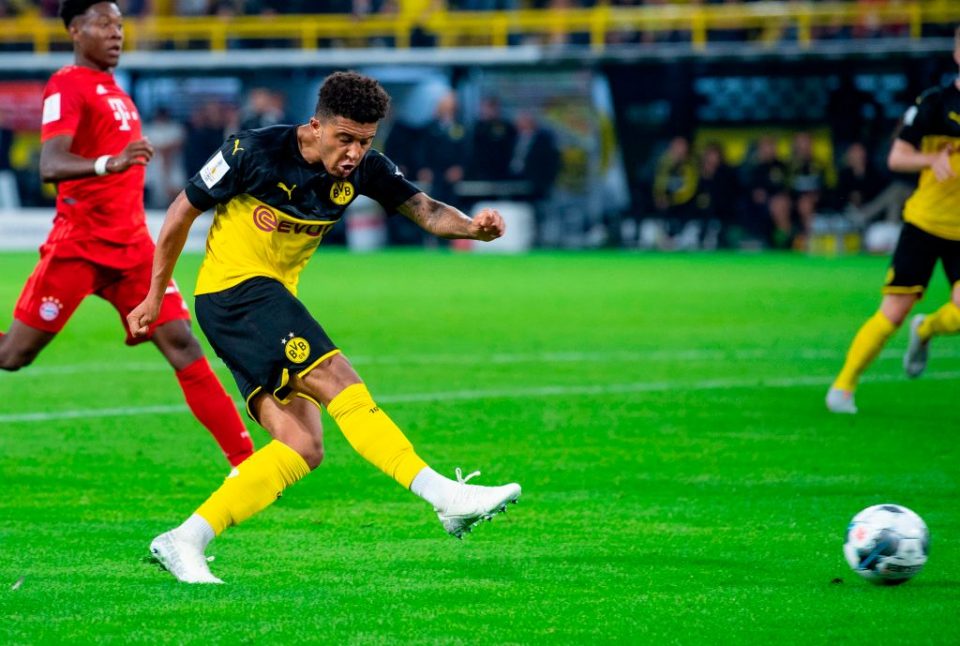 Dortmund's English midfielder Jadon Sancho scores the 2-0 goal during the German Supercup foorball match BVB Borussia Dortmund v FC Bayern Munich on August 3, 2019 at the Signal Iduna Park in Dortmund, western Germany. (Photo by Guido Kirchner / dpa / AFP) / Germany OUT        (Photo credit should read GUIDO KIRCHNER/AFP/Getty Images)