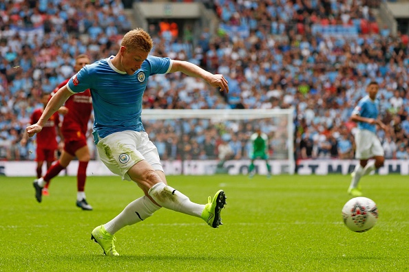 Manchester City's Belgian midfielder Kevin De Bruyne plays the ball into the box during the English FA Community Shield football match between Manchester City and Liverpool at Wembley Stadium in north London on August 4, 2019. (Photo by Adrian DENNIS / AFP) / NOT FOR MARKETING OR ADVERTISING USE / RESTRICTED TO EDITORIAL USE        (Photo credit should read ADRIAN DENNIS/AFP/Getty Images)