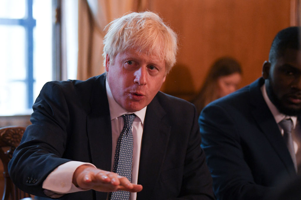 LONDON, ENGLAND - AUGUST 12: Britain's Prime Minister Boris Johnson speaks flanked by Youth Justice Board Adviser Roy Sefa-Attakora (R) during a round table on the criminal justice system at 10 Downing Street on August 12, 2019 in London, England. (Photo by Daniel Leal-Olivas - WPA Pool/Getty Images)