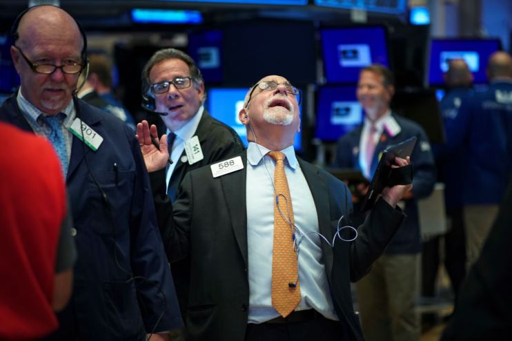 Global stock markets dragged down as recession warning lights flash