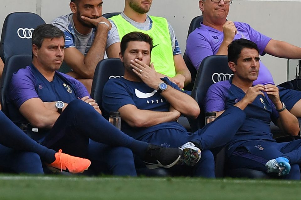 Tottenham Hotspur's Argentinian head coach Mauricio Pochettino (C) gestures in his seat during the English Premier League football match between Tottenham Hotspur and Newcastle United at Tottenham Hotspur Stadium in London, on August 25, 2019. (Photo by Daniel LEAL-OLIVAS / AFP) / RESTRICTED TO EDITORIAL USE. No use with unauthorized audio, video, data, fixture lists, club/league logos or 'live' services. Online in-match use limited to 120 images. An additional 40 images may be used in extra time. No video emulation. Social media in-match use limited to 120 images. An additional 40 images may be used in extra time. No use in betting publications, games or single club/league/player publications. /         (Photo credit should read DANIEL LEAL-OLIVAS/AFP/Getty Images)