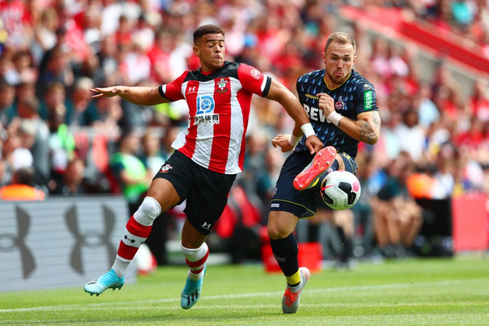 SOUTHAMPTON, ENGLAND - AUGUST 03:  Che Adams of Southampton  battles for the ball with Rafael Czichos of 1.FC Koln during the Pre-Season Friendly match between Southampton and FC Koln at St. Mary's Stadium on August 03, 2019 in Southampton, England. (Photo by Dan Istitene/Getty Images)