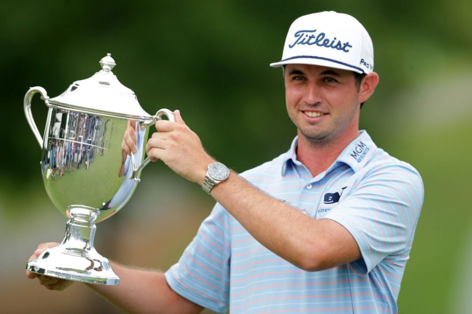 GREENSBORO, NORTH CAROLINA - AUGUST 04: J.T. Poston celebrates with the trophy after winning the Wyndham Championship at Sedgefield Country Club on August 04, 2019 in Greensboro, North Carolina. (Photo by Tyler Lecka/Getty Images)