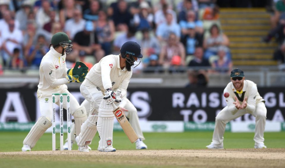 BIRMINGHAM, ENGLAND - AUGUST 05: Moeen Ali of England is caught out by David Warner of Australia during day five of the 1st Specsavers Ashes Test between England and Australia at Edgbaston on August 05, 2019 in Birmingham, England. (Photo by Gareth Copley/Getty Images)