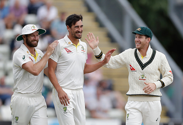 WORCESTER, ENGLAND - AUGUST 07: Mitchell Starc of Australia celebrates with Tim Paine of Australia after taking the wicket of Josh Dell of Worcestershire during day one of the Tour Match between Worcester CCC and Australia at New Road on August 07, 2019 in Worcester, England. (Photo by Ryan Pierse/Getty Images)