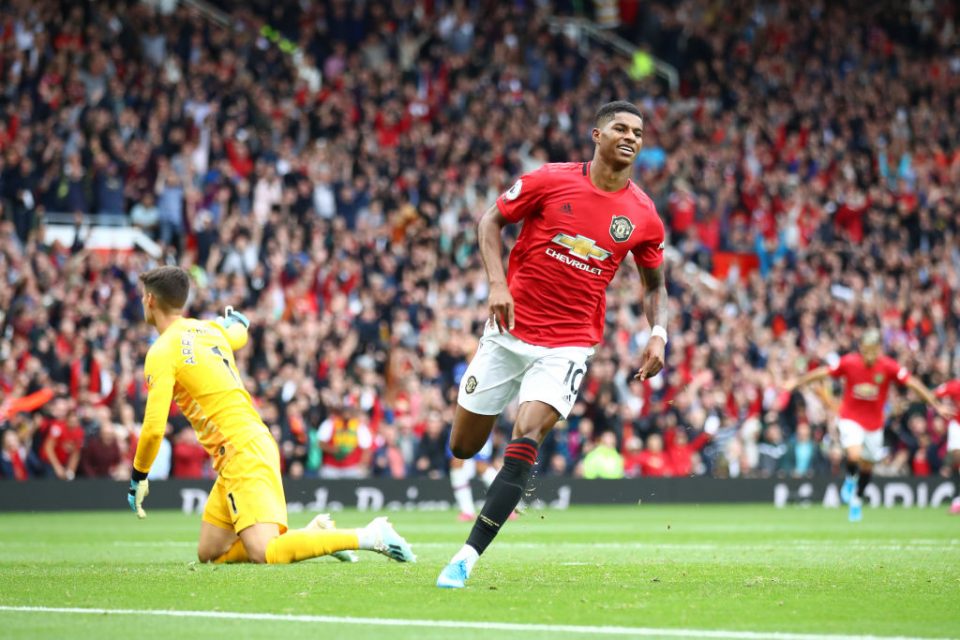 MANCHESTER, ENGLAND - AUGUST 11: Marcus Rashford of Manchester United celebrates after scoring his team's third goal during the Premier League match between Manchester United and Chelsea FC at Old Trafford on August 11, 2019 in Manchester, United Kingdom. (Photo by Julian Finney/Getty Images)
