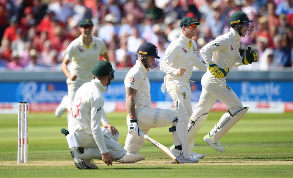 LONDON, ENGLAND - AUGUST 15: England batsman Ben Stokes reacts as Tim Paine (r) and Steve Smith (2nd r) celebrate after Nathan Lyon had taken his wicket during day two of the 2nd Test Match between England and Australia at Lord's Cricket Ground on August 15, 2019 in London, England. (Photo by Stu Forster/Getty Images)