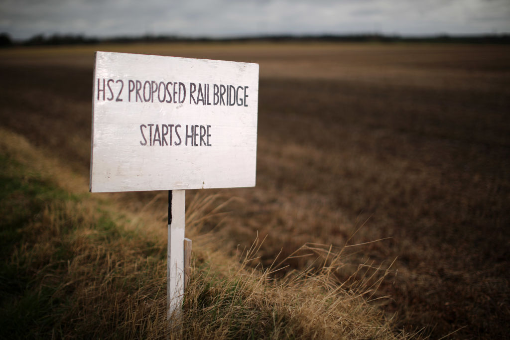 MIDDLETON, ENGLAND - JANUARY 29:  A sign erected by protesters marks the spot where a new rail bridge is proposed to be built across the countryside for the new HS2 high speed train link at the village of Middleton in Staffordshire on January 29, 2013 in Middleton near Tamworth, England.  The government yesterday released details of the next phase of the GBP 32 billion HS2 high-speed rail network, which will link Manchester and Leeds.  (Photo by Christopher Furlong/Getty Images)