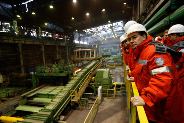 Russian Prime Minister Dmitry Medvedev visits of the rail and beam shop of Evraz, Russia's largest steelmaker, in the Siberian city of Novokuznetsk, on April 1, 2013. AFP PHOTO/ RIA-NOVOSTI/ POOL/ DMITRY ASTAKHOV        (Photo credit should read DMITRY ASTAKHOV/AFP/Getty Images)
