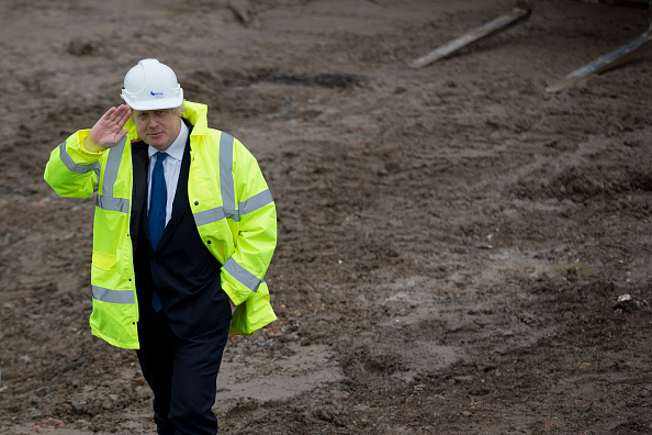 LONDON, ENGLAND - FEBRUARY 20: After a short demonstration on plastering, London Mayor, Boris Johnson is shown around the Aura residential development which is under construction in the Edgware district of north London on February 20, 2015 in London, England. Osborne and Johnson earlier on Friday announced plans to identify public sector sites in London for future housing developments and to increase 24-hour rail services across more underground tube lines, the London Overground trains and the London Docklands Light Railway in coming years. (Photo by Matt Dunham - WPA Pool /Getty Images)
