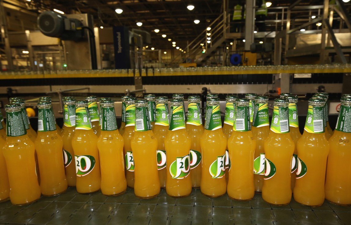 LEEDS, UNITED KINGDOM - APRIL 01:  Bottles of Britvic J2O soft drinks are displayed on the production line during a visit by Conservative Chancellor George Osborne on April 1, 2015 in Leeds, United Kingdom. One hundred business leaders have written to a newspaper to express support for the Conservative party's policies including backing cuts in corporation tax and it's handling of the economy.  (Photo by Christopher Furlong/Getty Images)