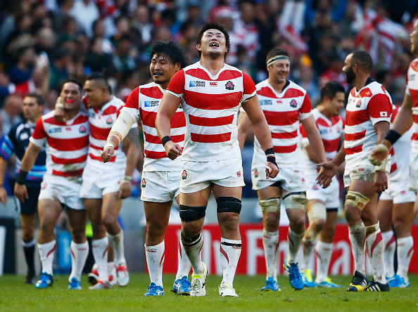 BRIGHTON, ENGLAND - SEPTEMBER 19:  Japan players celebrate their surprise victory during the 2015 Rugby World Cup Pool B match between South Africa and Japan at the Brighton Community Stadium on September 19, 2015 in Brighton, United Kingdom.  (Photo by Julian Finney/Getty Images)